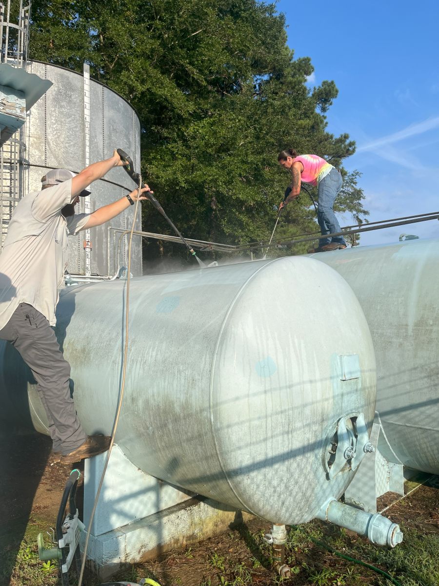 Power washing the pressure tanks 